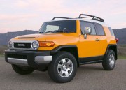 163_0809_31z+2009_toyota_fj_cruiser+yellow_drivers_front_three_quarters_view.jpg